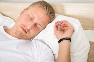 Man Wearing Smart Wristband While Sleeping