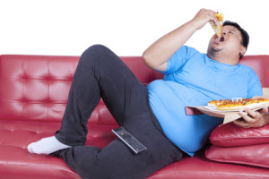 Overweight man eats pizza 1